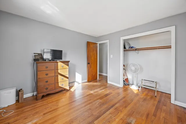 a view of workspace with wooden floor and window