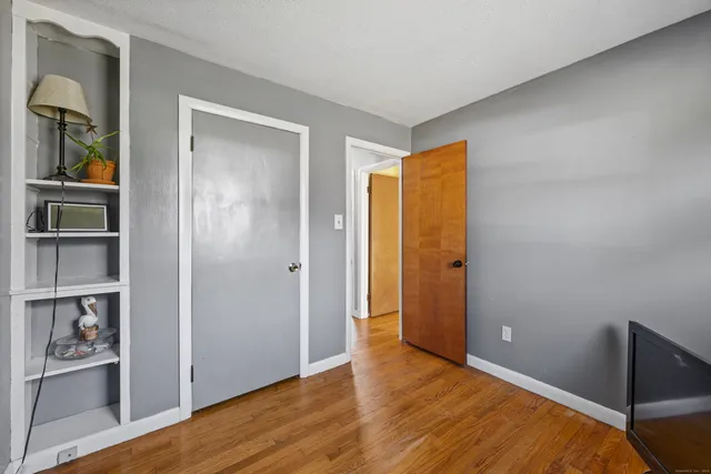 a view of a bedroom from a hallway