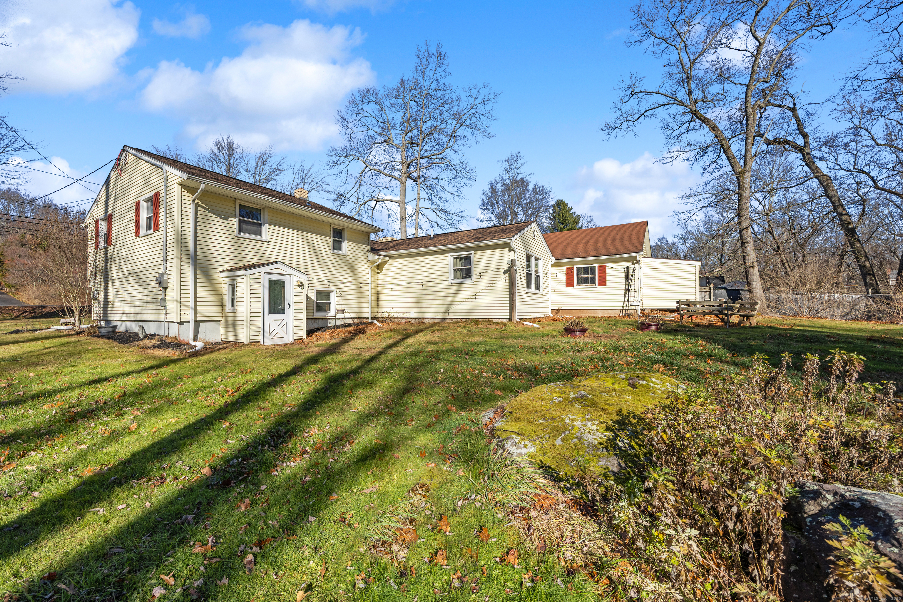 122 North Airline Road Wallingford, CT 06492 - Photo 29 of 33 a view of a white house with a yard next to a road