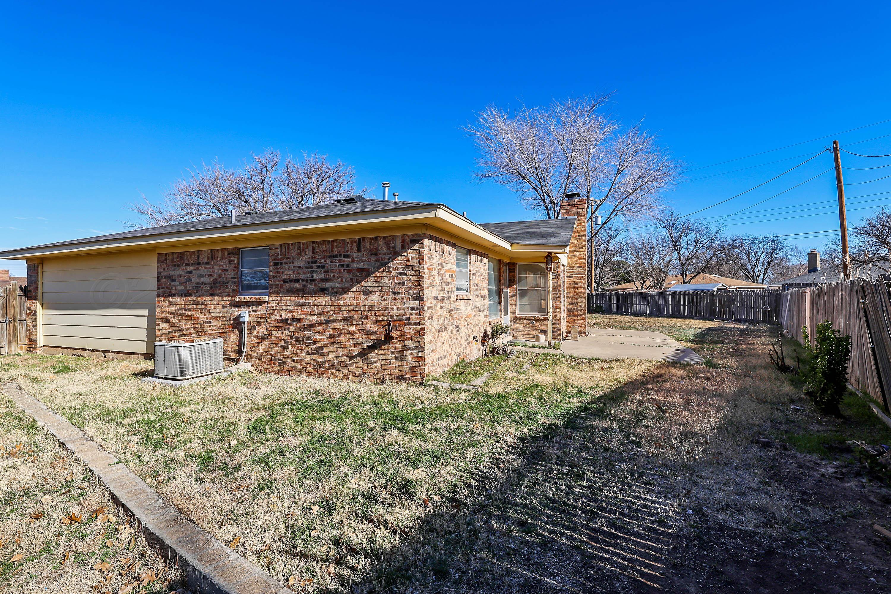 4415 Kingston Road Amarillo, TX 79109 - Photo 28 of 28 a view of a house with a yard