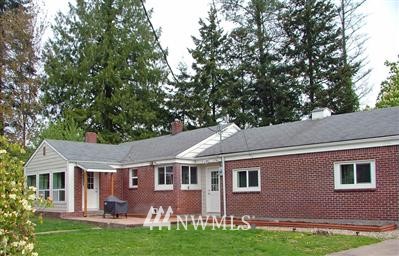 18827 Grannis Road Bothell, WA 98012 - Photo 1 of 1 a front view of house with yard and green space