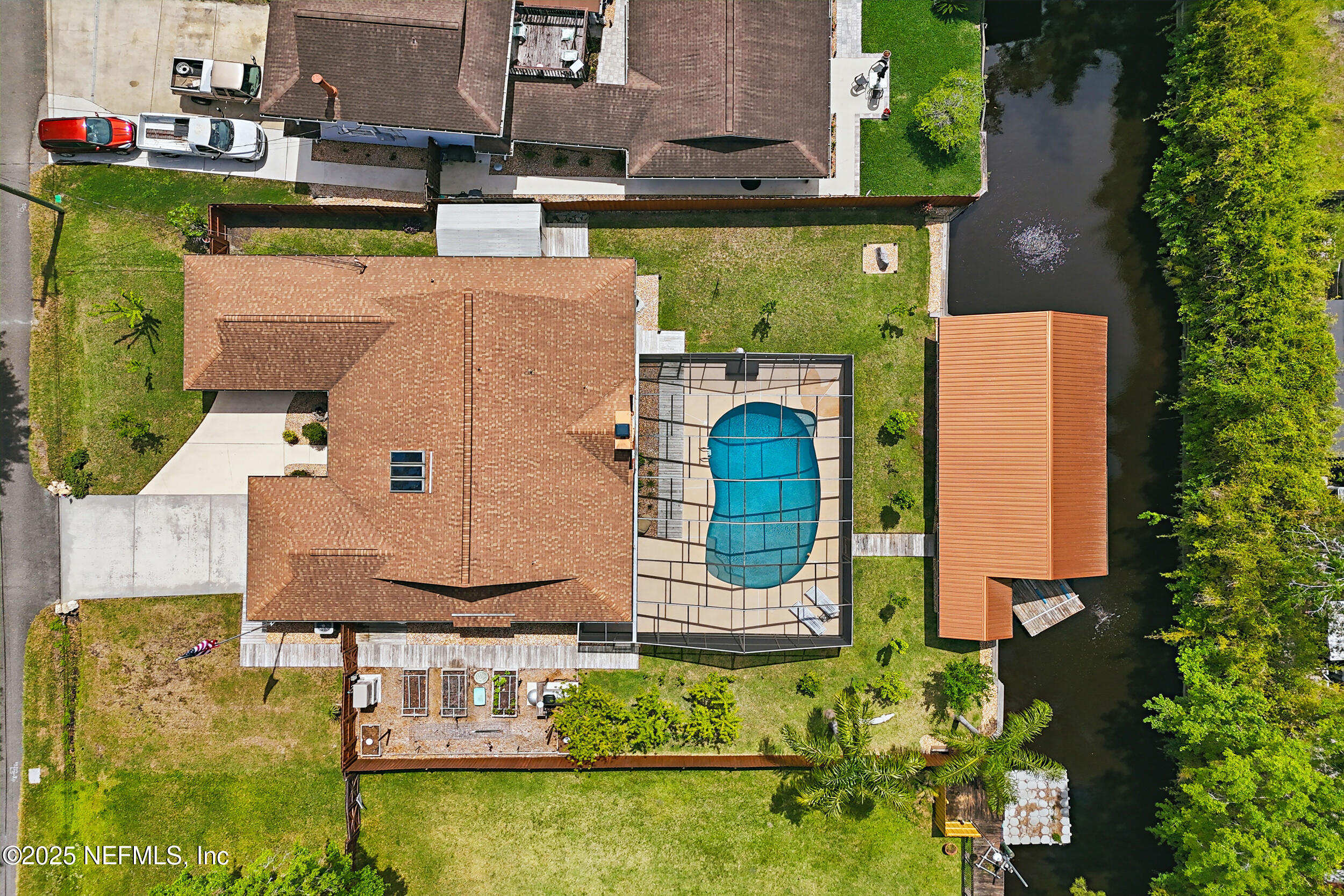 an aerial view of a house with a swimming pool