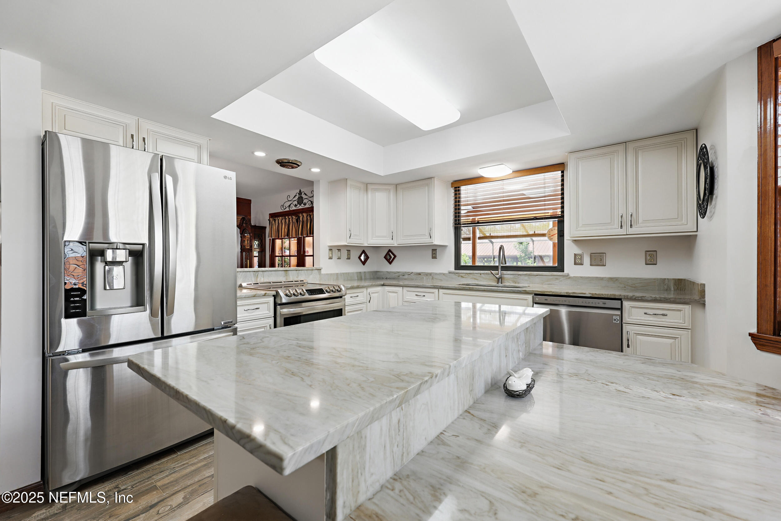 3154 Brooks Road Fleming Island, FL 32003 - Photo 15 of 53 a kitchen with stainless steel appliances granite countertop a refrigerator sink and stove