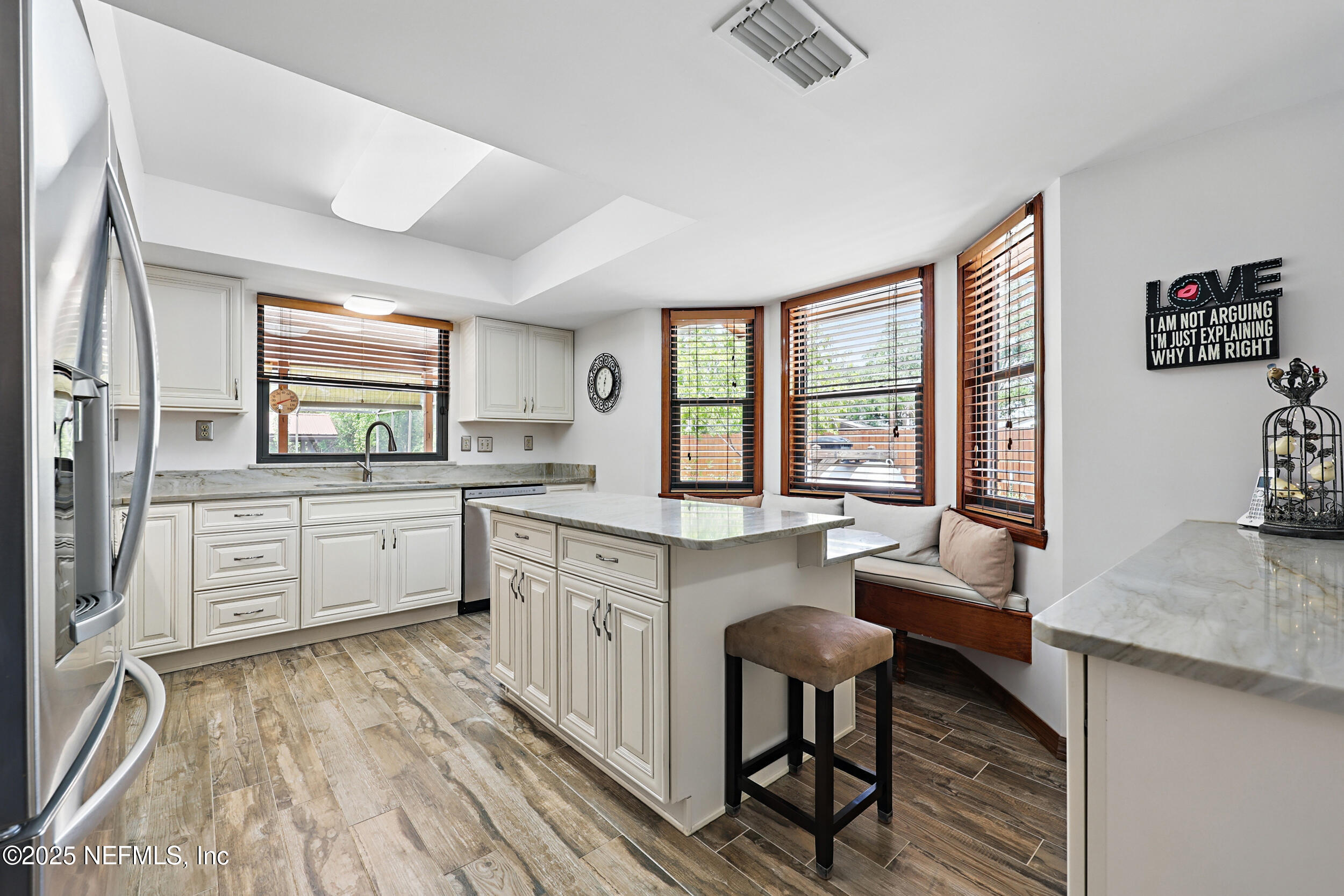 3154 Brooks Road Fleming Island, FL 32003 - Photo 17 of 53 a kitchen with stainless steel appliances granite countertop a stove a sink and a refrigerator