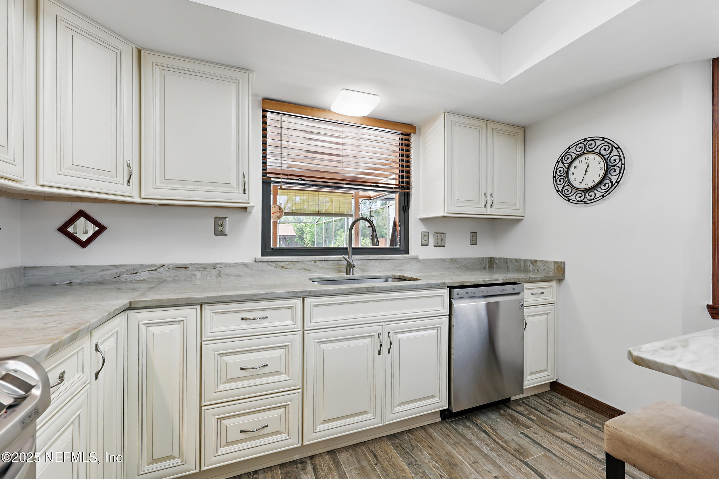 3154 Brooks Road Fleming Island, FL 32003 - Photo 18 of 53 a kitchen with granite countertop white cabinets and white appliances