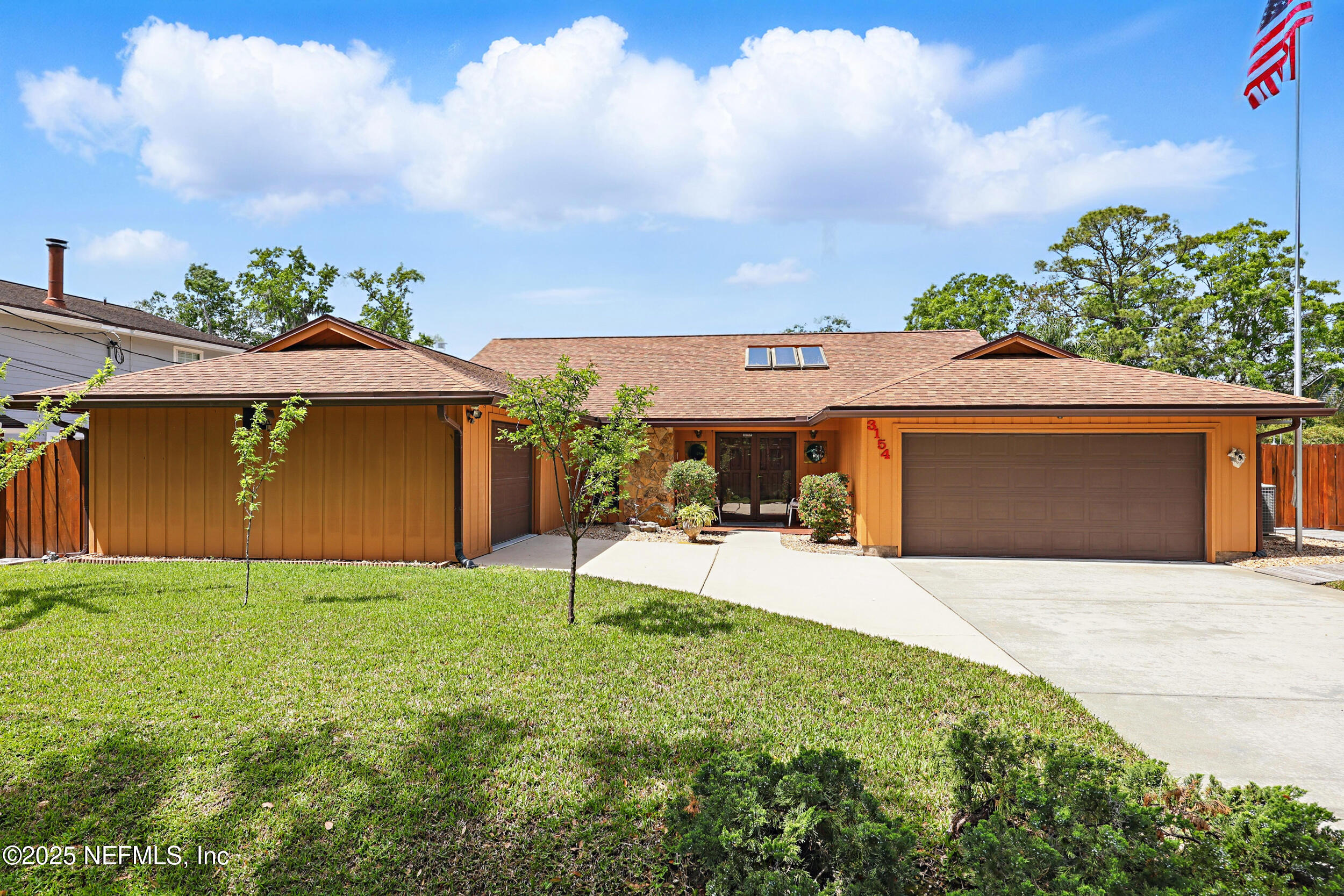 3154 Brooks Road Fleming Island, FL 32003 - Photo 2 of 53 a view of a backyard with a garden and plants