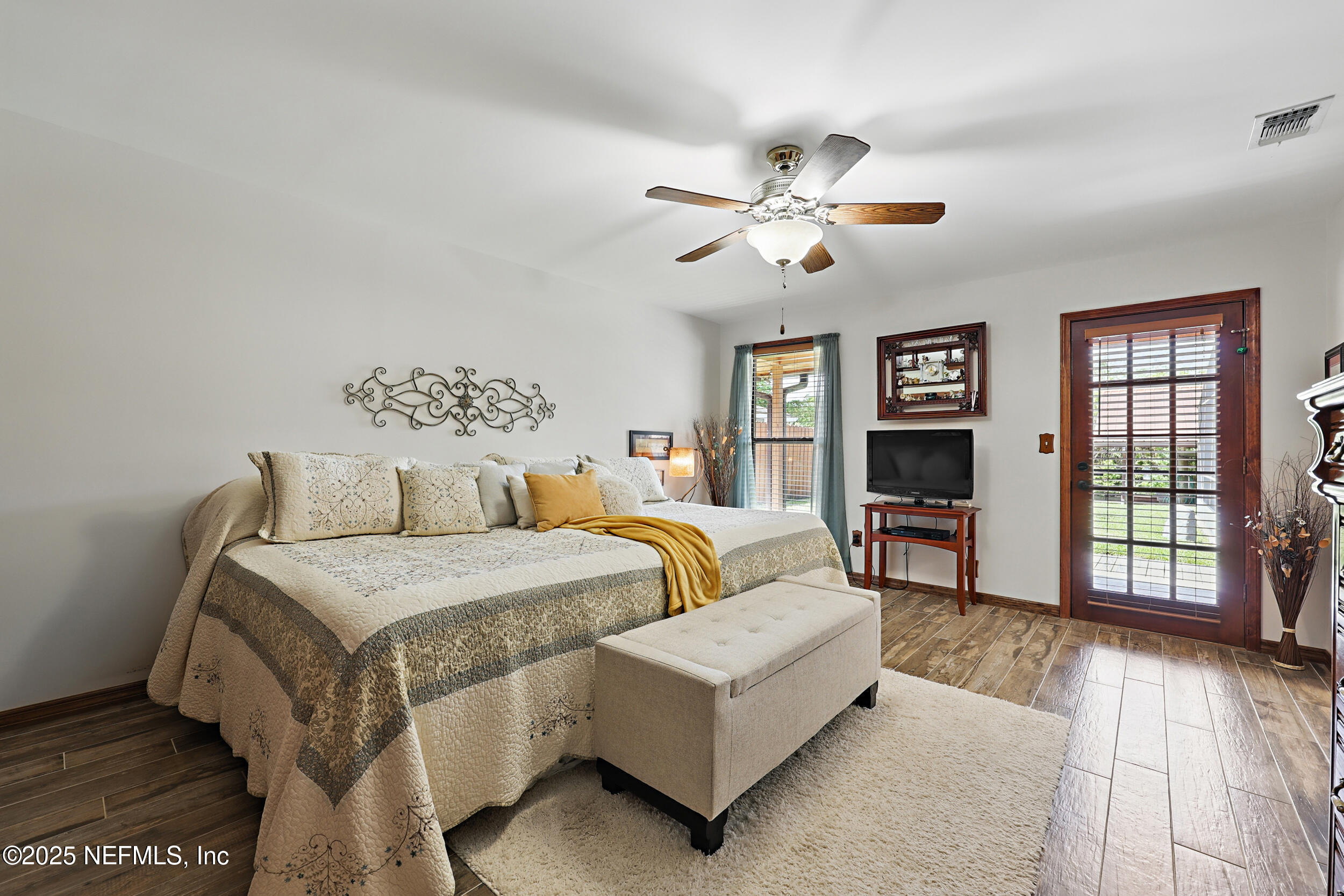 3154 Brooks Road Fleming Island, FL 32003 - Photo 21 of 53 a bedroom with a bed a couch and dresser