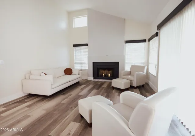 a view of a livingroom with furniture and wooden floor