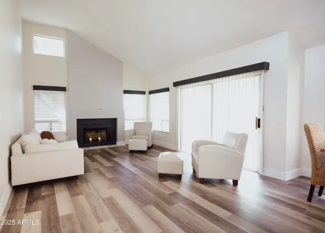 a kitchen with stainless steel appliances kitchen island granite countertop a stove a microwave and a refrigerator