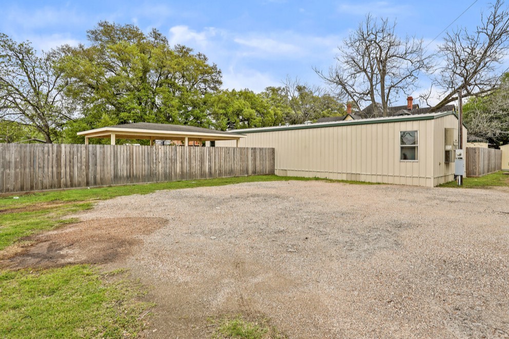 1030 4th Street Rosenberg, TX 77471 - Photo 31 of 38 a view of backyard with tree
