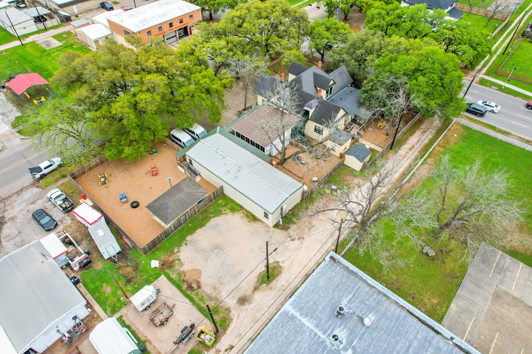 1030 4th Street Rosenberg, TX 77471 - Photo 36 of 38 an aerial view of a house with a yard and lake view
