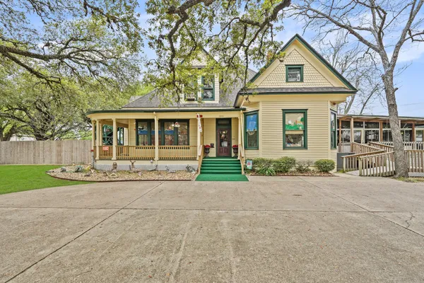 front view of a house next to a yard