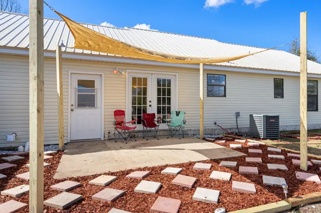 a house view with a backyard space