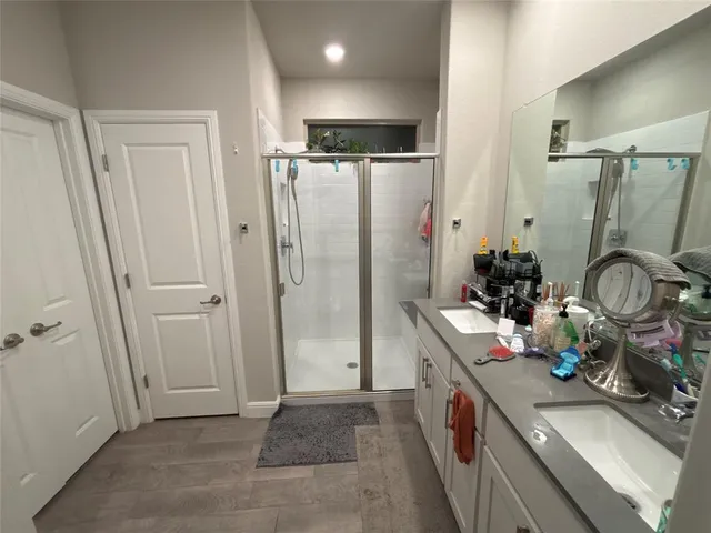 a bed room with a bed and a chandelier