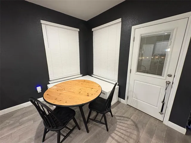 a view of a hallway with seating area