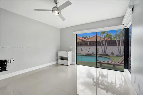 a view of a hallway view with staircase and living room