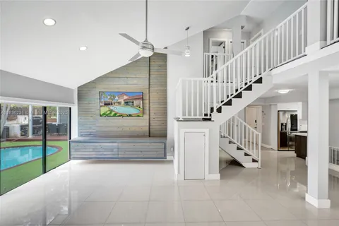 a kitchen with a sink appliances and cabinets
