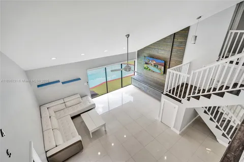 a hallway with a white stove top oven and sink