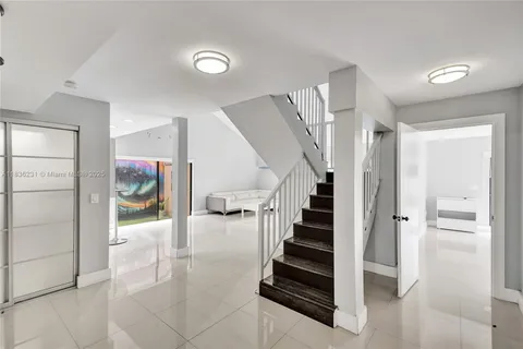 a room with furniture and a flat screen tv