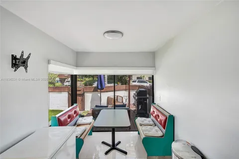 a view of a storage & utility room with two washing machine