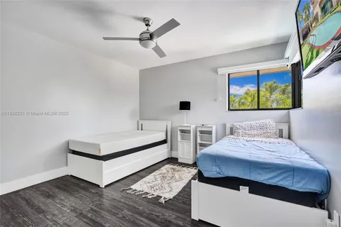 a view of a porch with furniture and floor to ceiling window