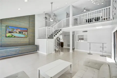 a view of entryway and hall with a front door