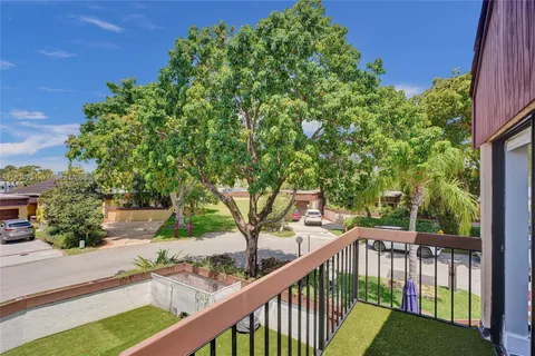 a view of a patio with a table and chairs