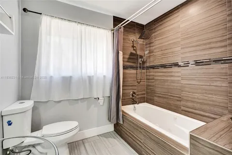 a view of kitchen with table and chairs
