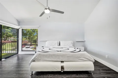 a swimming pool with outdoor seating yard and barbeque oven