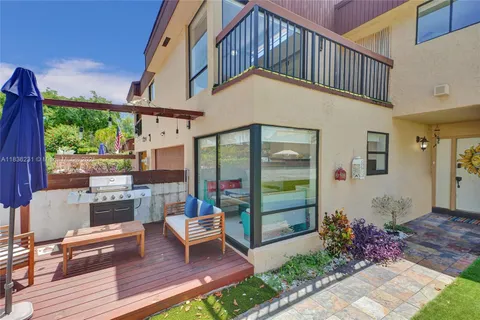a front view of a house with a yard and a garage