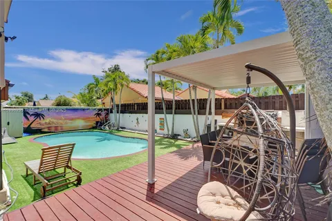 an aerial view of multiple houses with yard