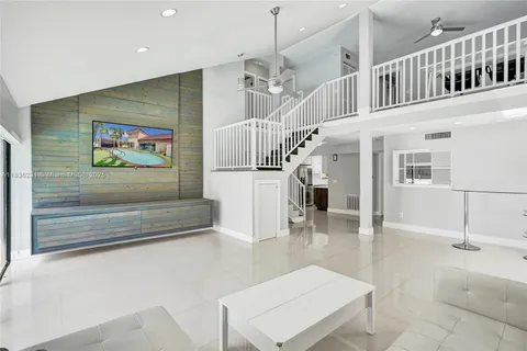 a view of entryway and hall with a living room
