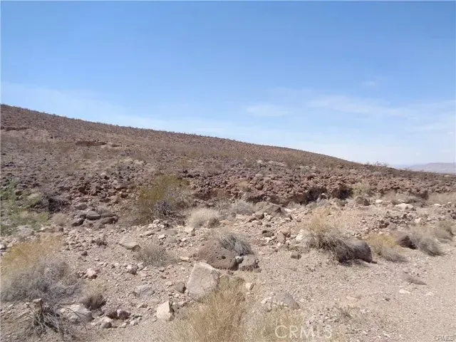 a view of an ocean beach and mountain