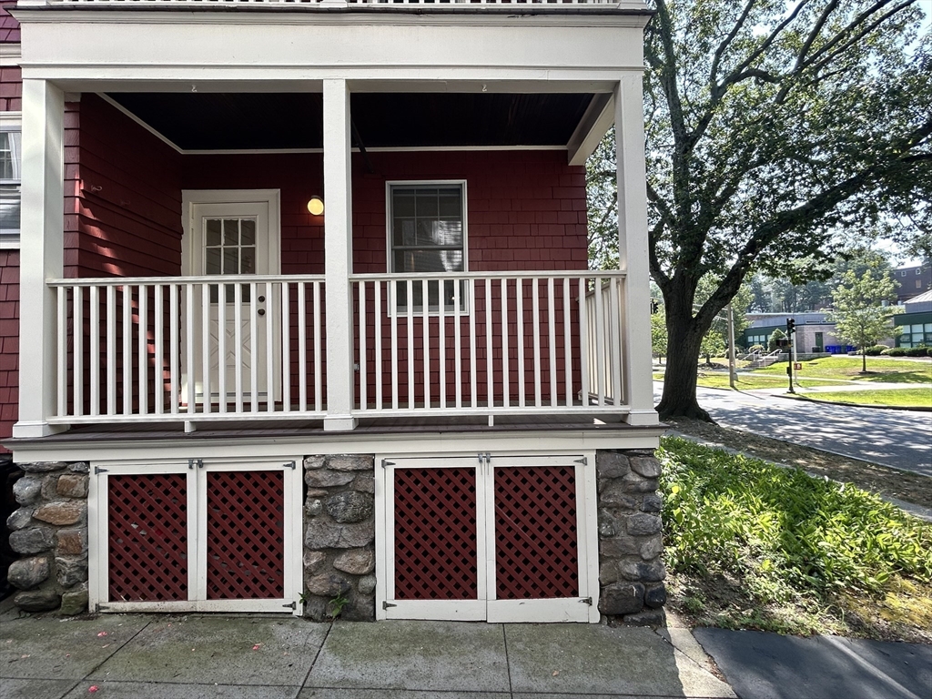 59 Ackers Avenue, Unit 1 Brookline, MA 02445 - Photo 13 of 13 front view of a house with a yard and an trees