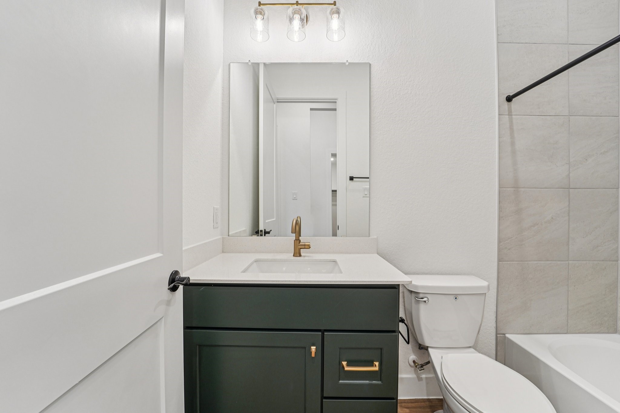 15727 Hoptree Hts Lane Conroe, TX 77302 - Photo 17 of 44 a bathroom with a sink toilet vanity and mirror