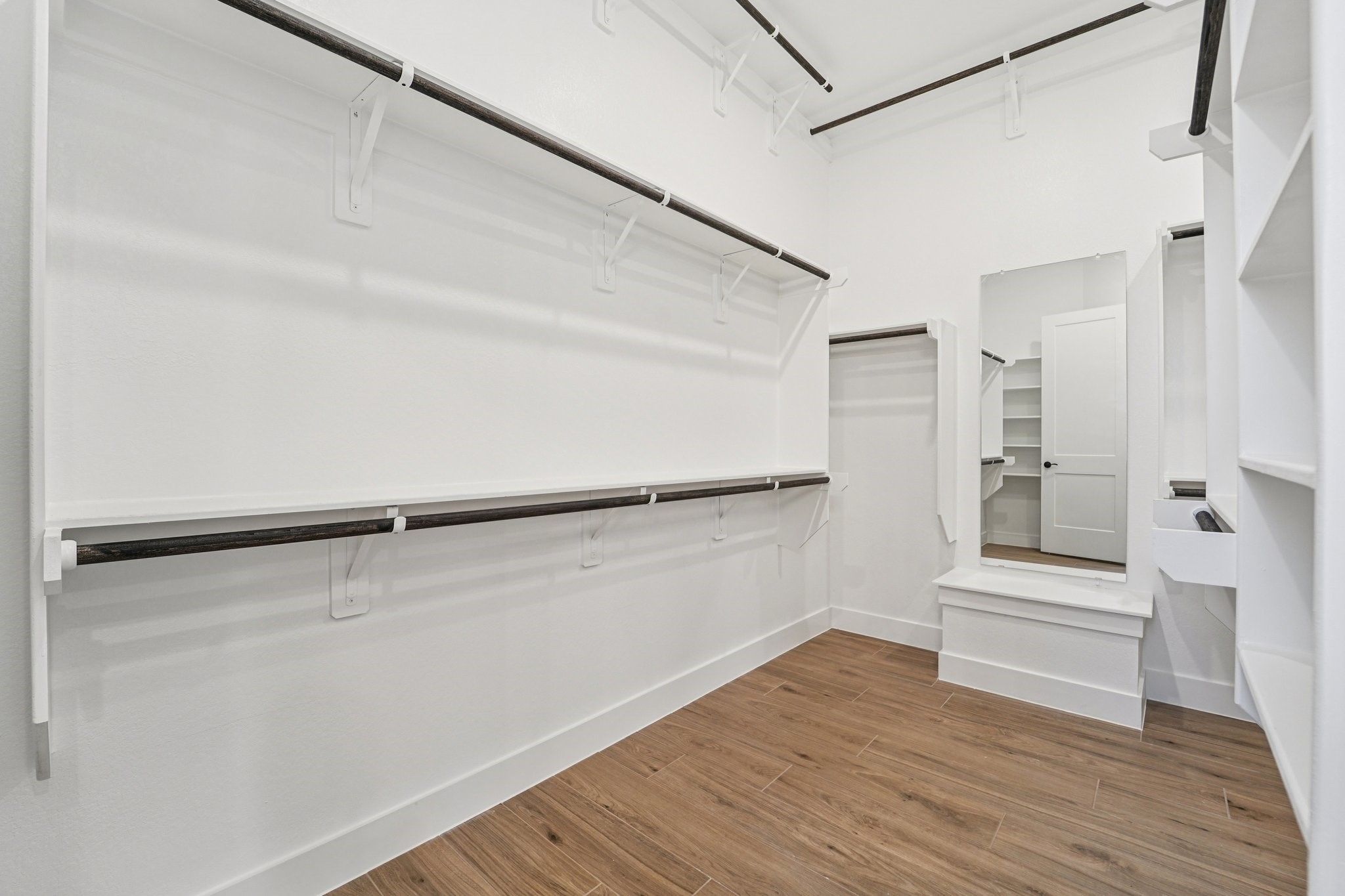 15727 Hoptree Hts Lane Conroe, TX 77302 - Photo 18 of 44 a view of walk in closet with empty racks