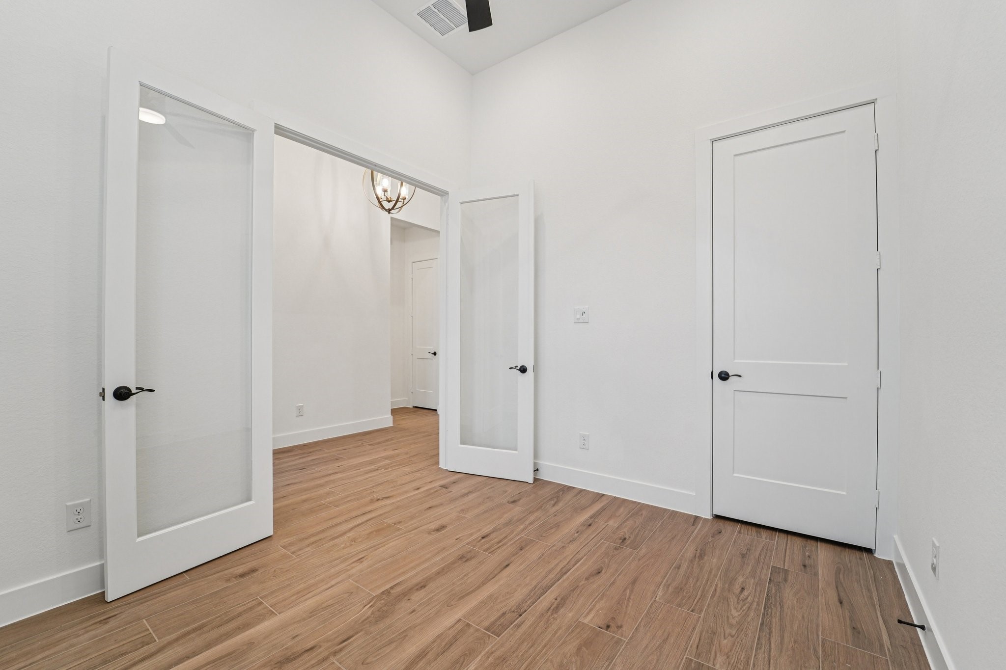 15727 Hoptree Hts Lane Conroe, TX 77302 - Photo 22 of 44 a view of an empty room with wooden floor