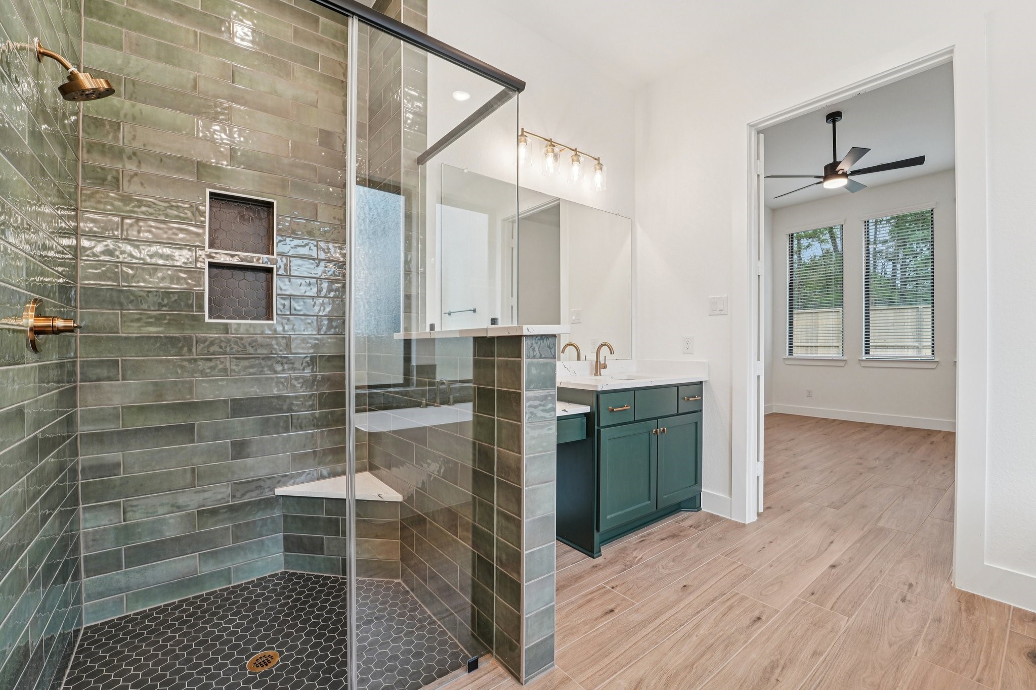 15727 Hoptree Hts Lane Conroe, TX 77302 - Photo 23 of 44 a bathroom with a sink a toilet and shower