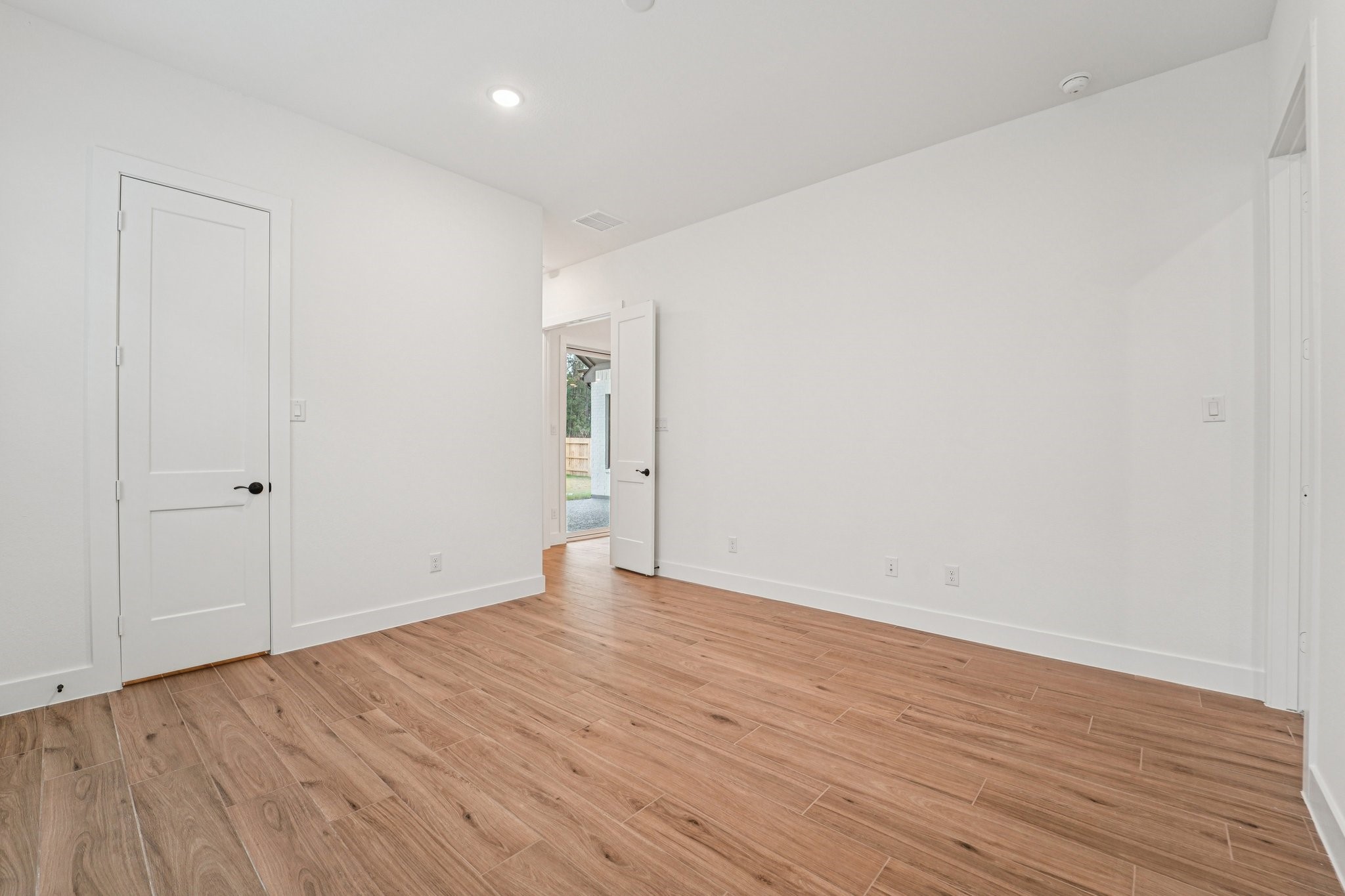15727 Hoptree Hts Lane Conroe, TX 77302 - Photo 28 of 44 a view of an empty room with wooden floor