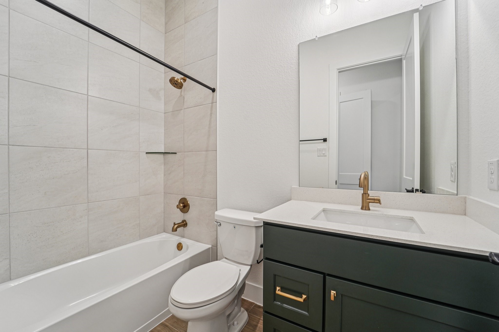 15727 Hoptree Hts Lane Conroe, TX 77302 - Photo 33 of 44 a bathroom with a sink a toilet and shower