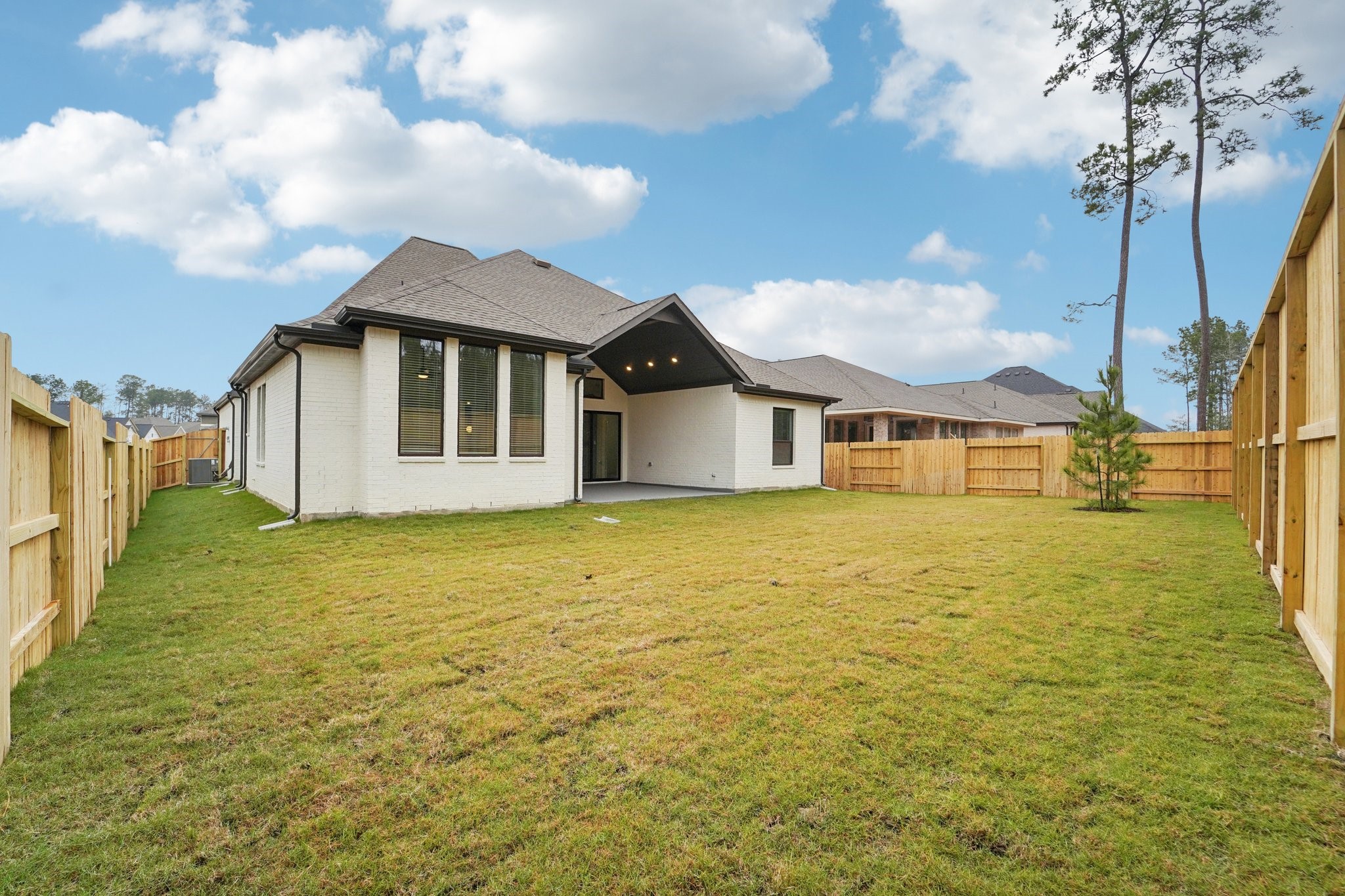 15727 Hoptree Hts Lane Conroe, TX 77302 - Photo 36 of 44 a front view of a house with a yard