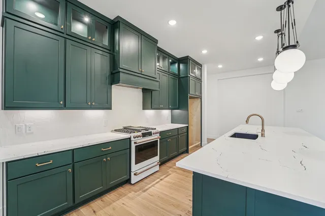 a kitchen with a sink and cabinets