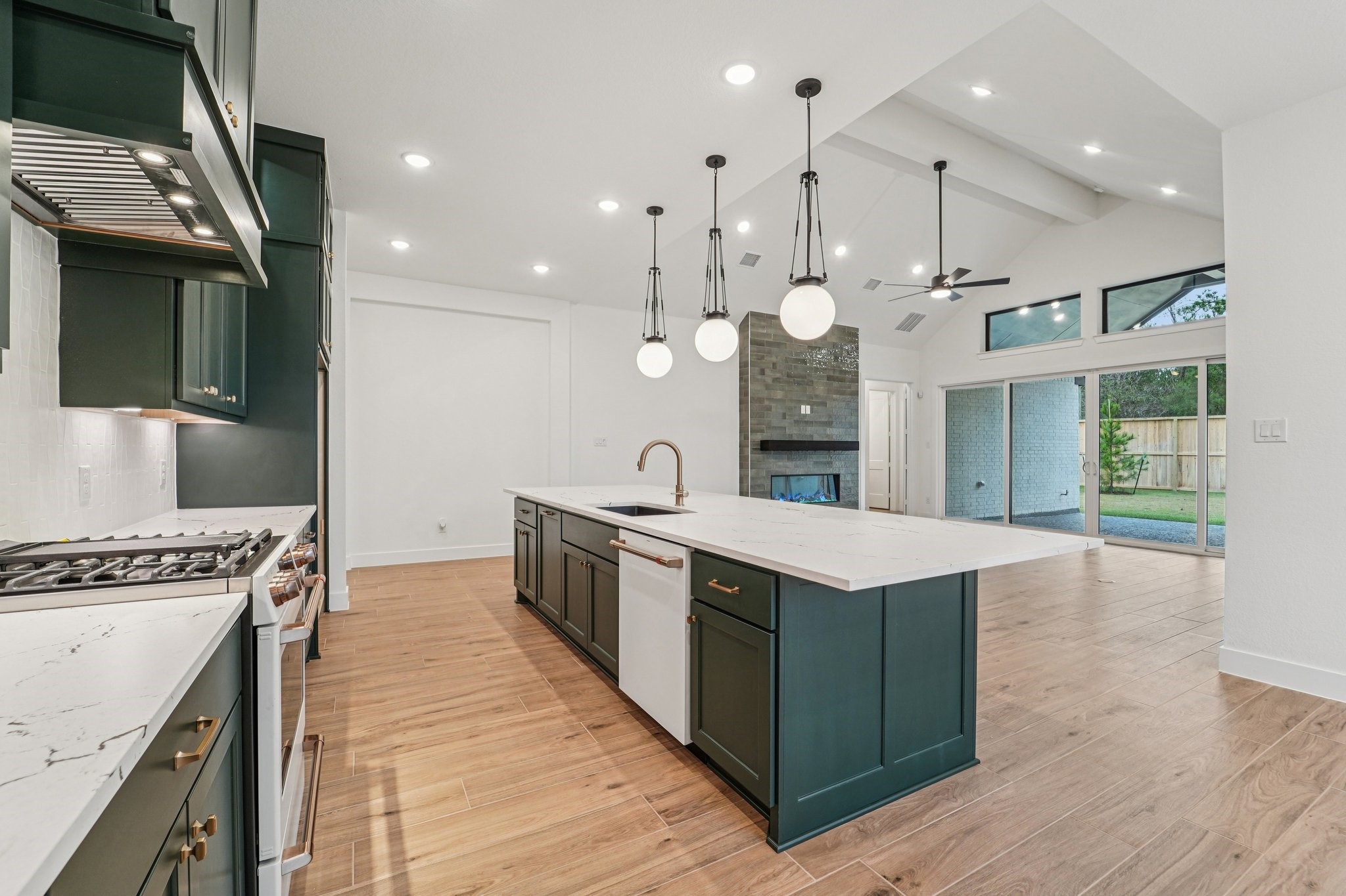 15727 Hoptree Hts Lane Conroe, TX 77302 - Photo 7 of 44 a kitchen with a stove and a wooden floor