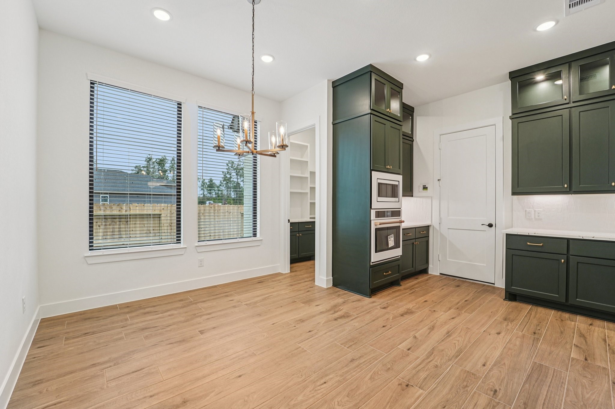 15727 Hoptree Hts Lane Conroe, TX 77302 - Photo 8 of 44 a kitchen with stainless steel appliances granite countertop a refrigerator and a stove top oven