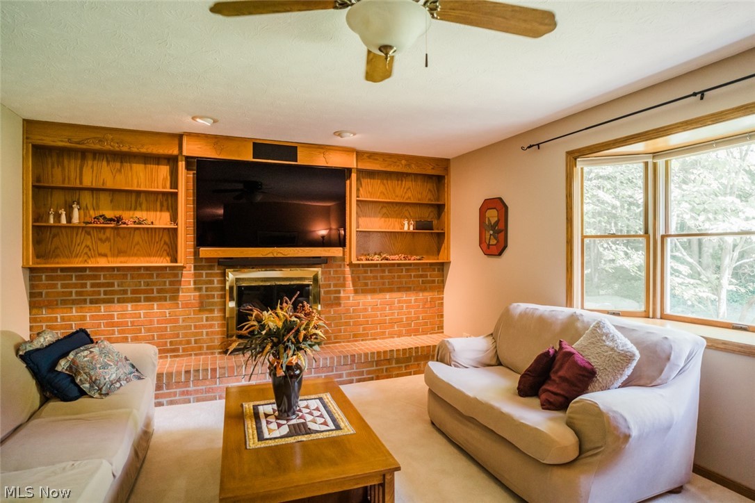 695 South Medina Line Road Akron, OH 44321 - Photo 7 of 17 Full wall fireplace with built-in bookcases in Family room. Bay window to enjoy private backyard too.