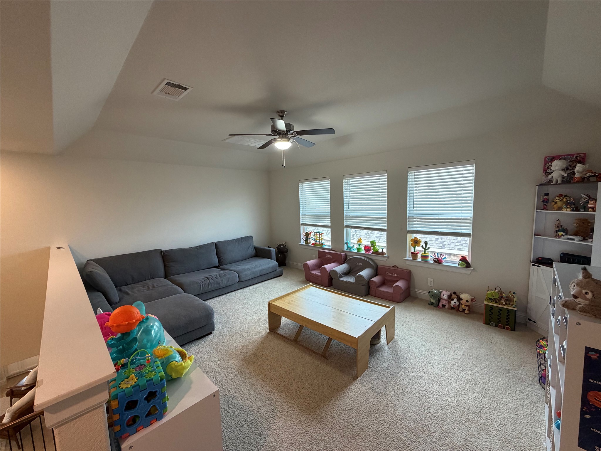 8709 Moccasin Path Austin, TX 78736 - Photo 11 of 34 Carpeted living room with a ceiling fan