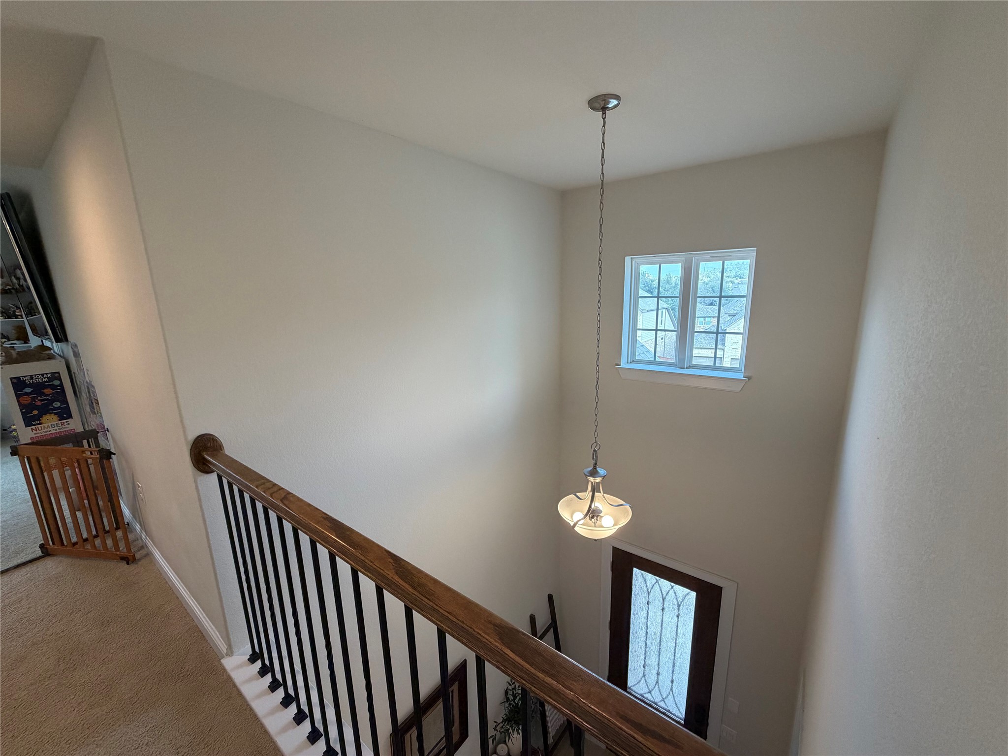 8709 Moccasin Path Austin, TX 78736 - Photo 15 of 34 Stairway with a high ceiling and carpet floors