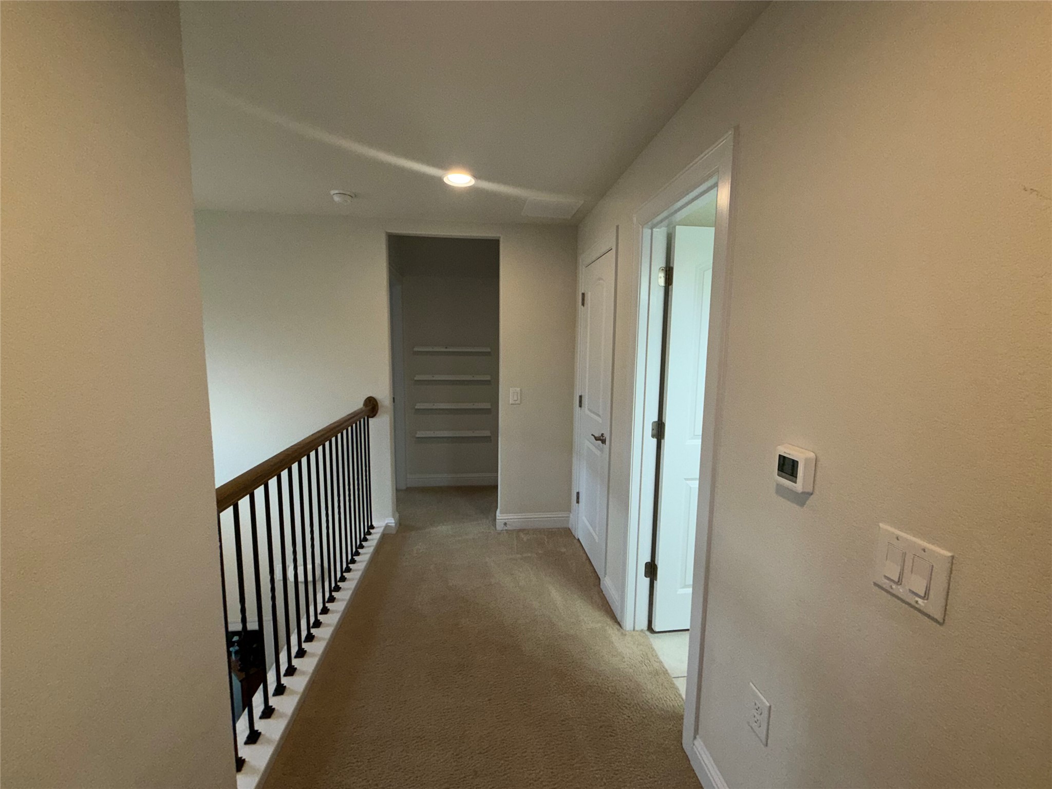 8709 Moccasin Path Austin, TX 78736 - Photo 20 of 34 Hallway featuring light colored carpet and recessed lighting