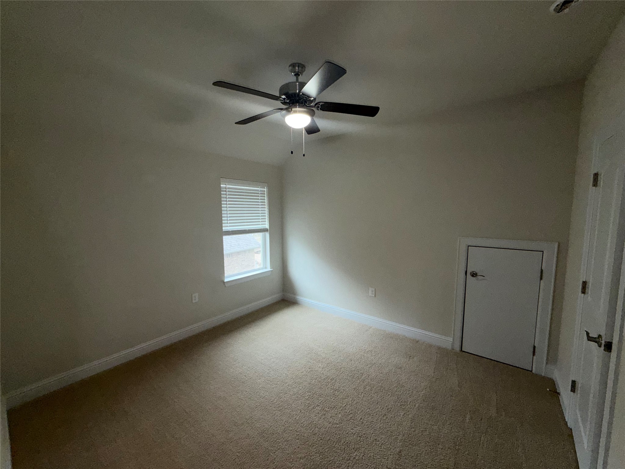 8709 Moccasin Path Austin, TX 78736 - Photo 23 of 34 Empty room with light carpet and ceiling fan