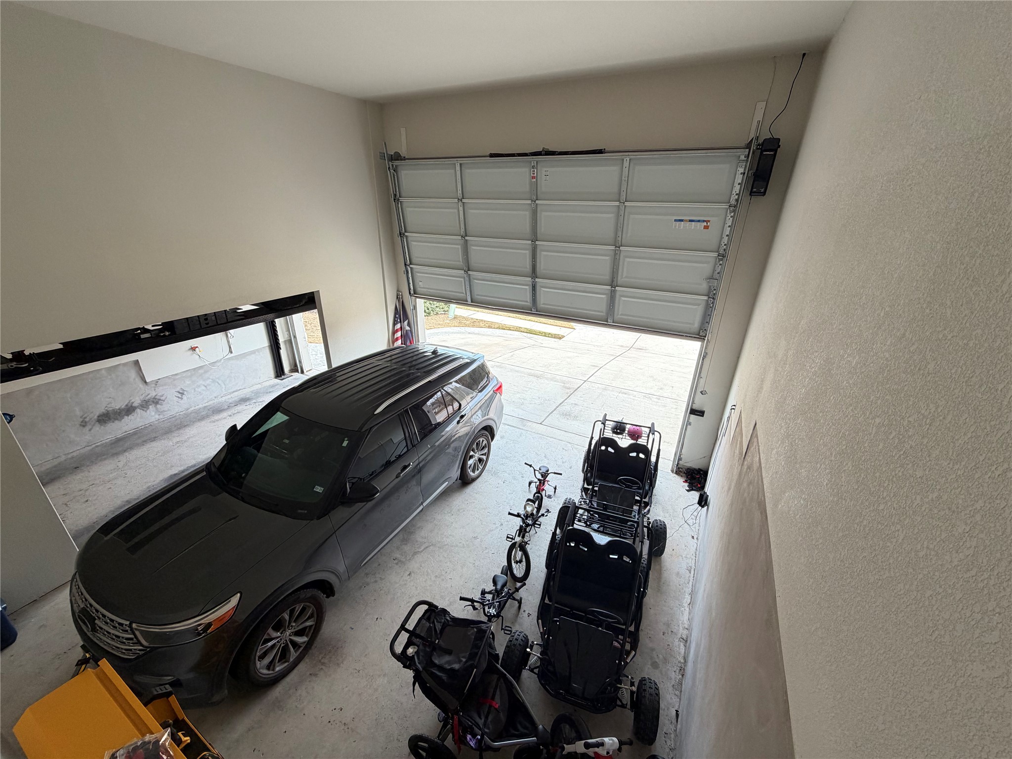 8709 Moccasin Path Austin, TX 78736 - Photo 29 of 34 Garage with a textured wall
